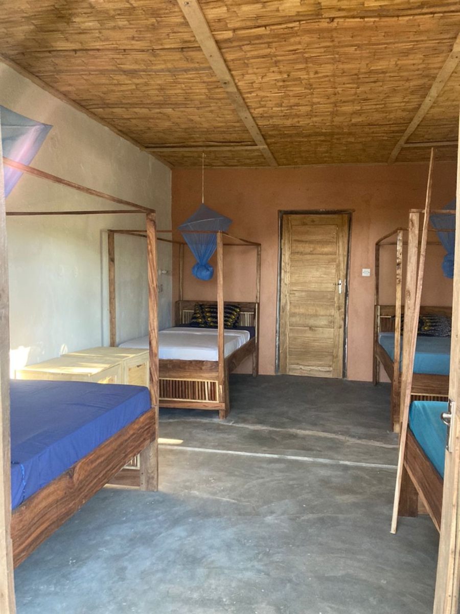 Family room with three beds and mosquito nets